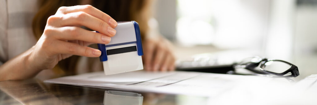 Notary Rubber Stamp In Hand